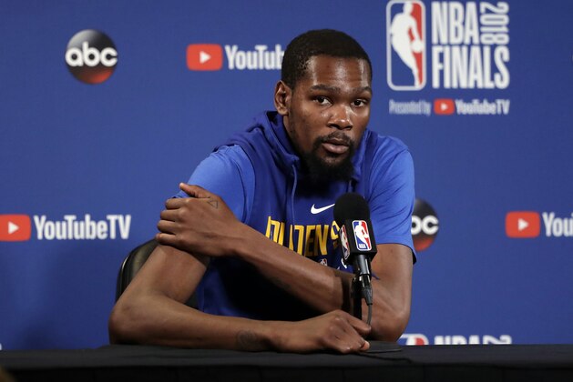 Golden State Warriors' Kevin Durant answers questions after an NBA basketball practice, Wednesday, May 30, 2018, in Oakland, Calif. The Warriors face the Cleveland Cavaliers in Game 1 of the NBA Finals on Thursday in Oakland. (AP Photo/Marcio Jose Sanchez)