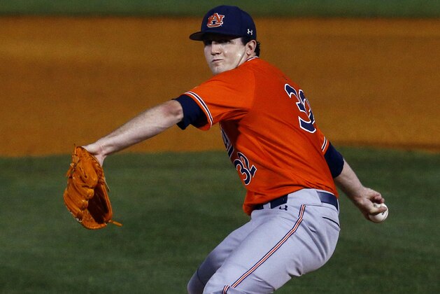 Auburn pitcher Casey Mize throws during the first inning of a Southeastern Conference tournament NCAA college baseball game against Texas A&M, Thursday, May 24, 2018, in Hoover, Ala. (AP Photo/Butch Dill)