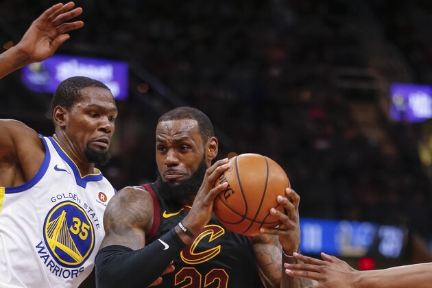 CLEVELAND, OH - JANUARY 15: LeBron James #23 of the Cleveland Cavaliers dribbles against Kevin Durant #35 of the Golden State Warriors at Quicken Loans Arena on January 15, 2018 in Cleveland, Ohio. NOTE TO USER: User expressly acknowledges and agrees that, by downloading and or using this photograph, User is consenting to the terms and conditions of the Getty Images License Agreement.(Photo by Michael Hickey/Getty Images)