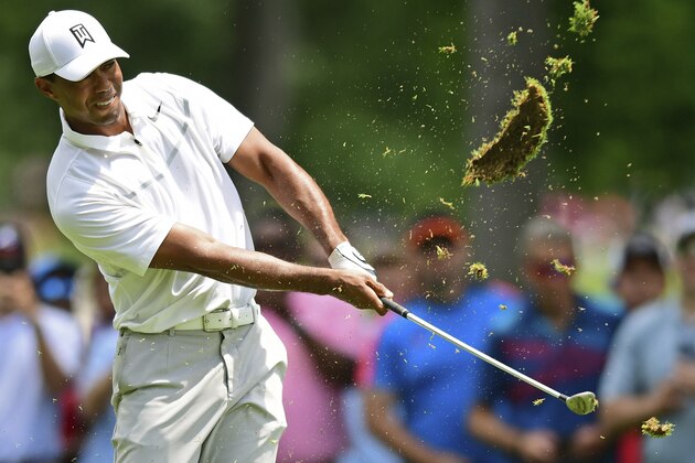 Tiger Woods follows through on his swing on the ninth hole during the first round of the Memorial golf tournament Thursday, May 31, 2018, in Dublin, Ohio. (AP Photo/David Dermer)