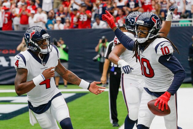 HOUSTON, TX - SEPTEMBER 10:  DeAndre Hopkins #10 of the Houston Texans and Deshaun Watson #4 celebrate after a score in the third quarter at NRG Stadium on September 10, 2017 in Houston, Texas.  (Photo by Bob Levey/Getty Images)