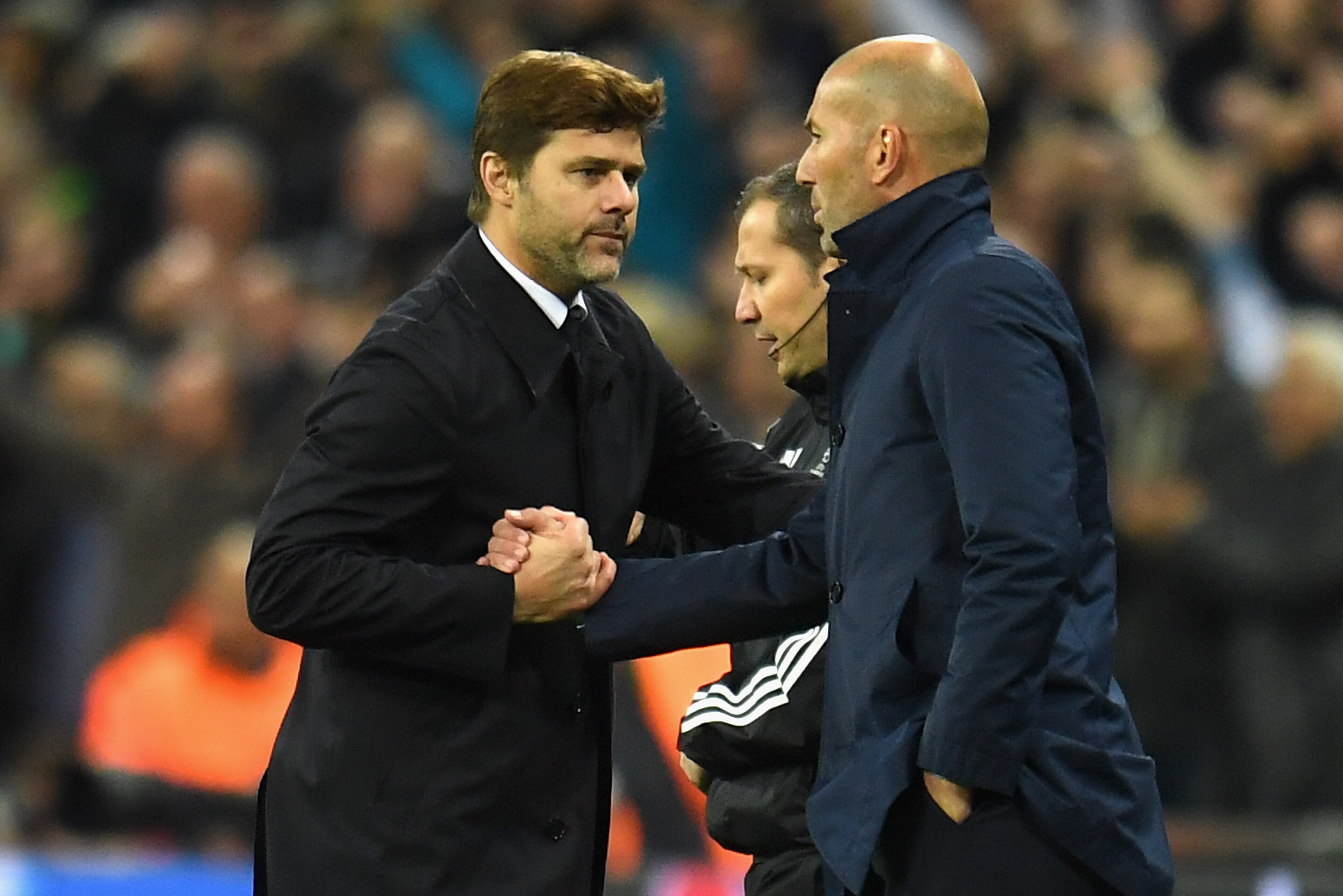 LONDON, ENGLAND - NOVEMBER 01: Mauricio Pochettino, Manager of Tottenham Hotspur and Zinedine Zidane, Manager of Real Madrid shake hands following the game at the UEFA Champions League group H match between Tottenham Hotspur and Real Madrid at Wembley Stadium on November 1, 2017 in London, United Kingdom. (Photo by Mike Hewitt/Getty Images) LONDON, ENGLAND - NOVEMBER 01: Mauricio Pochettino, Manager of Tottenham Hotspur and Zinedine Zidane, Manager of Real Madrid shake hands following the game at the UEFA Champions League group H match between Tottenham Hotspur and Real Madrid at Wembley Stadium on November 1, 2017 in London, United Kingdom. (Photo by Mike Hewitt/Getty Images)