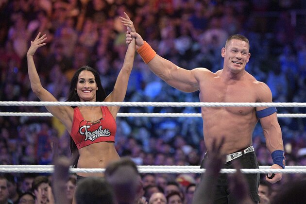 IMAGE DISTRIBUTED FOR WWE - WWE Superstars John Cena, right, and Nikki Bella show off the engagement ring after she accepted his marriage proposal during WrestleMania 33 on Sunday, April 2, 2017, in Orlando, Fla. (Phelan M. Ebenhack/AP Images for WWE)