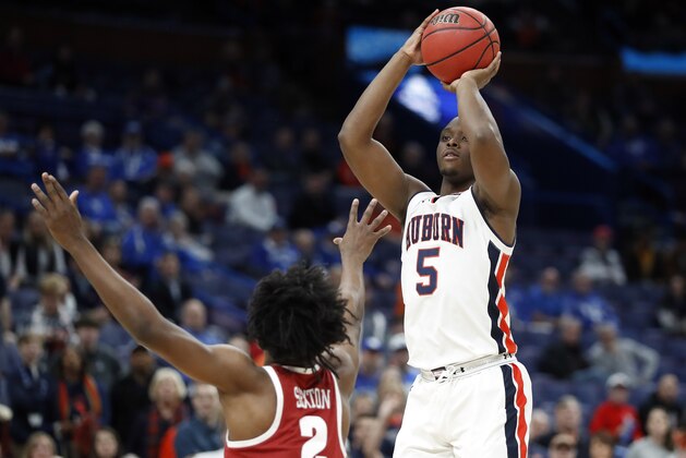 Auburn's Mustapha Heron (5) shoots over Alabama's Collin Sexton (2) during the first half in an NCAA college basketball quarterfinals game at the Southeastern Conference tournament Friday, March 9, 2018, in St. Louis. (AP Photo/Jeff Roberson)