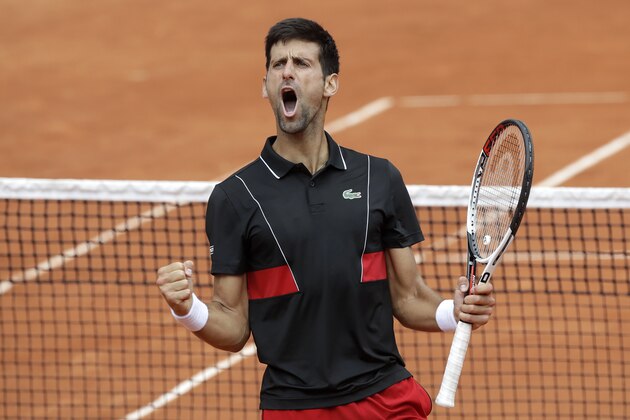 Serbia's Novak Djokovic celebrates scoring a point against Spain's Roberto Bautista Agut during their third round match of the French Open tennis tournament at the Roland Garros stadium in Paris, France, Friday, June 1, 2018. (AP Photo/Alessandra Tarantino)