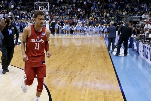 Oklahoma's Trae Young leaves the court after the NCAA men's college basketball tournament first-round game against Rhode Island, Thursday, March 15, 2018, in Pittsburgh. (AP Photo/Keith Srakocic)