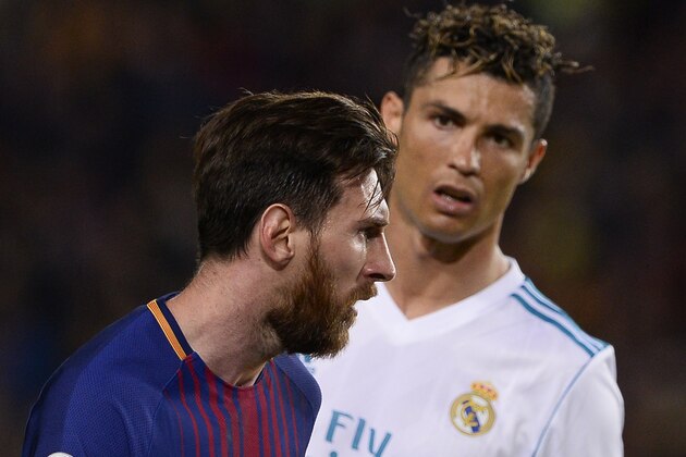 TOPSHOT - Real Madrid's Portuguese forward Cristiano Ronaldo (R) looks at Barcelona's Argentinian forward Lionel Messi during the Spanish league football match between FC Barcelona and Real Madrid CF at the Camp Nou stadium in Barcelona on May 6, 2018. (Photo by Josep LAGO / AFP) (Photo credit should read JOSEP LAGO/AFP/Getty Images) TOPSHOT - Real Madrid's Portuguese forward Cristiano Ronaldo (R) looks at Barcelona's Argentinian forward Lionel Messi during the Spanish league football match between FC Barcelona and Real Madrid CF at the Camp Nou stadium in Barcelona on May 6, 2018. (Photo by Josep LAGO / AFP) (Photo credit should read JOSEP LAGO/AFP/Getty Images)