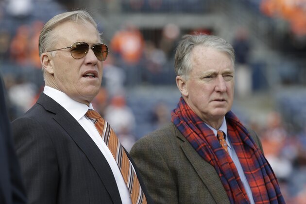 Denver Broncos general manager John Elway, left, stands with Broncos President and CEO Joe Ellis, right, before an NFL football game against the Oakland Raiders, Sunday, Jan. 1, 2017, in Denver. (AP Photo/Jack Dempsey)