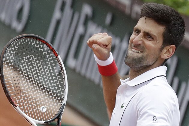 Serbia's Novak Djokovic clenches his fist after scoring a point against Spain's Roberto Bautista Agut during their third round match of the French Open tennis tournament at the Roland Garros stadium in Paris, France, Friday, June 1, 2018. (AP Photo/Alessandra Tarantino)