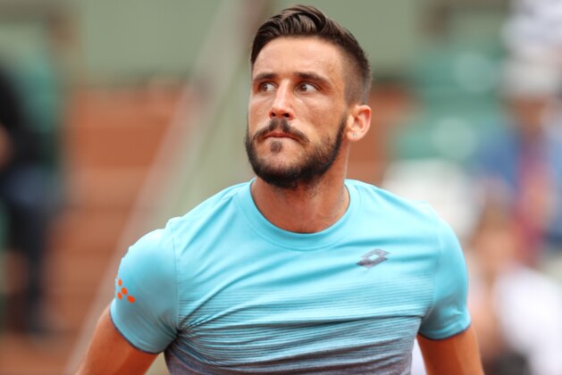 PARIS, FRANCE - JUNE 01:  Damir Dzumhur of Bosnia and Herzegovinia looks on during his mens singles third round match against Alexander Zverev of Germany during day six of the 2018 French Open at Roland Garros on June 1, 2018 in Paris, France.  (Photo by Matthew Stockman/Getty Images)