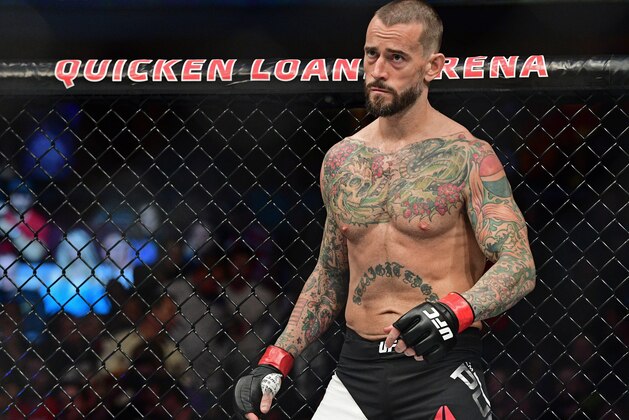 CM Punk stands in his corner before a welterweight bout at UFC 203 on Saturday, Sept. 10, 2016, in Cleveland. Mickey Gall won via submission. (AP Photo/David Dermer)