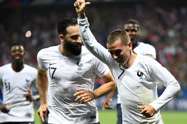 France's foward Antoine Griezmann (R) celebrates with France's defender Adil Rami (L) after scoring a penalty kick  during the friendly football match between France and Italy at the Allianz Riviera Stadium in Nice, southeastern France, on June 1, 2018. (Photo by FRANCK FIFE / AFP)        (Photo credit should read FRANCK FIFE/AFP/Getty Images)