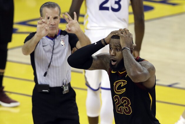 Cleveland Cavaliers forward LeBron James (23) reacts to a call during the second half of Game 1 of basketball's NBA Finals between the Golden State Warriors and the Cavaliers in Oakland, Calif., Thursday, May 31, 2018. (AP Photo/Marcio Jose Sanchez)