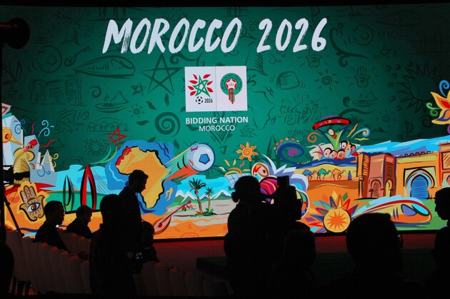 FILE - In this Saturday March 17, 2018 file photo, a giant screen display the logo of Morocco 2026 inside of the reception before a press conference to promote Morocco's bib for the 2026 soccer World Cup in Casablanca, Morocco. The North American bid to host the 2026 World Cup has outscored Morocco following inspections with FIFA labeling the North African proposal FILE - In this Saturday March 17, 2018 file photo, a giant screen display the logo of Morocco 2026 inside of the reception before a press conference to promote Morocco's bib for the 2026 soccer World Cup in Casablanca, Morocco. The North American bid to host the 2026 World Cup has outscored Morocco following inspections with FIFA labeling the North African proposal