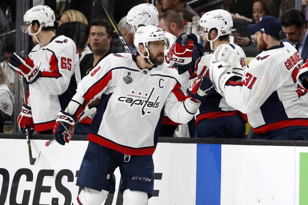 Washington Capitals left wing Alex Ovechkin, of Russia, celebrates his goal with teammates at the bench during the second period in Game 2 of the team's NHL hockey Stanley Cup Finals against the Vegas Golden Knights on Wednesday, May 30, 2018, in Las Vegas. (AP Photo/John Locher)