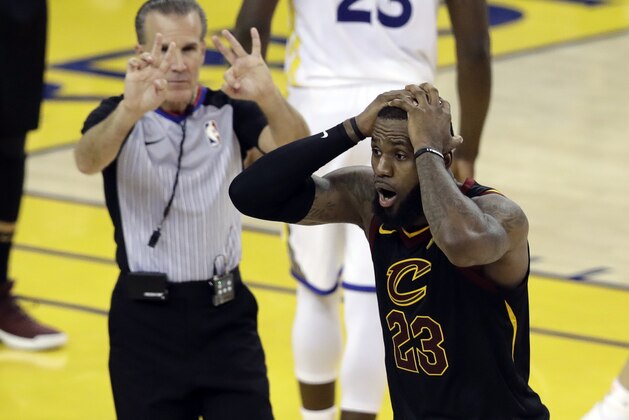 Cleveland Cavaliers forward LeBron James (23) reacts to a call during the second half of Game 1 of basketball's NBA Finals between the Golden State Warriors and the Cavaliers in Oakland, Calif., Thursday, May 31, 2018. (AP Photo/Marcio Jose Sanchez)