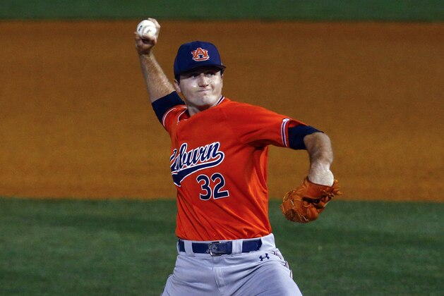 Auburn pitcher Casey Mize throws a pitch during the first inning of a Southeastern Conference tournament NCAA college baseball game against Texas A&M, Thursday, May 24, 2018, in Hoover, Ala. (AP Photo/Butch Dill)