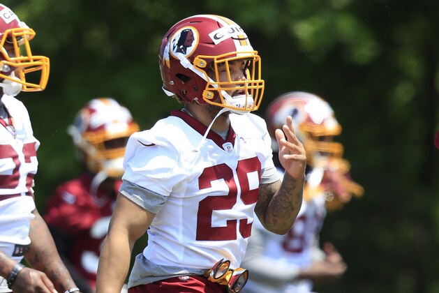 Washington Redskin's second-round pick Derrius Guice (29) and Martez Carter (22) from Grambling State, perform stretching exercises at the NFL football team's rookie minicamp at Redskins Park in Ashburn, Va., Friday, May 11, 2018. (AP Photo/Manuel Balce Ceneta)