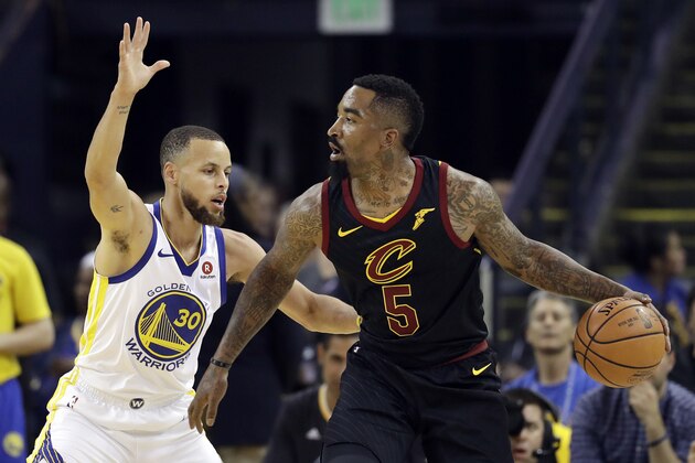 Cleveland Cavaliers guard J.R. Smith (5) is defended by Golden State Warriors guard Stephen Curry (30) during the first half of Game 1 of basketball's NBA Finals in Oakland, Calif., Thursday, May 31, 2018. (AP Photo/Marcio Jose Sanchez)