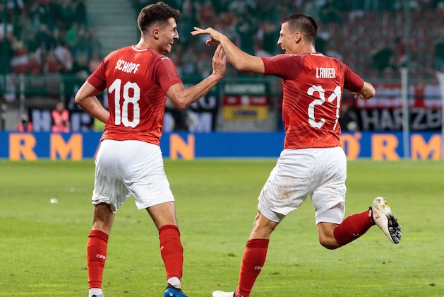 Austria's midfielder Alessandro Schoepf (L) celebrates scoring with his team-mate defender Stefan Lainer during the international friendly footbal match Austria v Germany in Klagenfurt, Austria, on June 2, 2018. (Photo by Johann GRODER / APA / AFP) / Austria OUT        (Photo credit should read JOHANN GRODER/AFP/Getty Images)