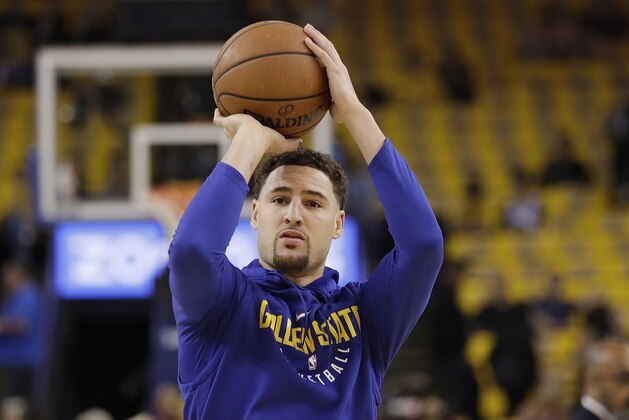 Golden State Warriors guard Klay Thompson warms up before Game 3 of the NBA basketball Western Conference Finals against the Houston Rockets in Oakland, Calif., Sunday, May 20, 2018. (AP Photo/Marcio Jose Sanchez)