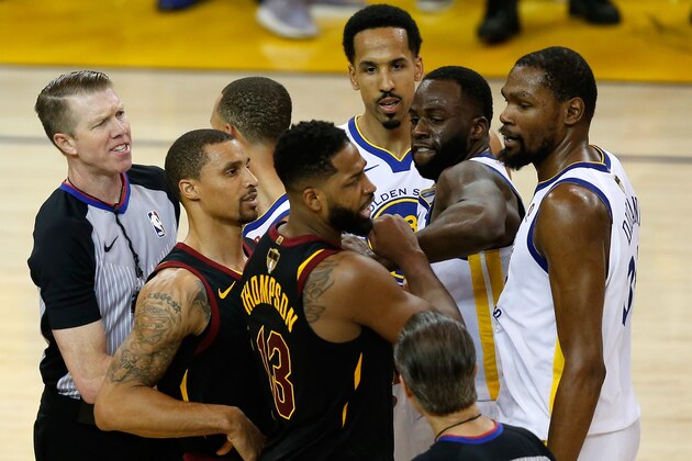 OAKLAND, CA - MAY 31:  Tristan Thompson #13 of the Cleveland Cavaliers and Draymond Green #23 of the Golden State Warriors get involved in a altercation in overtime during Game 1 of the 2018 NBA Finals at ORACLE Arena on May 31, 2018 in Oakland, California. NOTE TO USER: User expressly acknowledges and agrees that, by downloading and or using this photograph, User is consenting to the terms and conditions of the Getty Images License Agreement.  (Photo by Lachlan Cunningham/Getty Images)