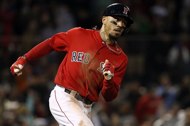 Boston Red Sox's Mookie Betts runs on an RBI double against the Baltimore Orioles during the fifth inning of a baseball game at Fenway Park in Boston Friday, May 18, 2018.(AP Photo/Winslow Townson)