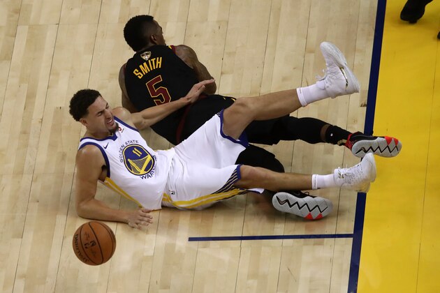 OAKLAND, CA - MAY 31:  Klay Thompson #11 of the Golden State Warriors reacts after being fouled by JR Smith #5 of the Cleveland Cavaliers in Game 1 of the 2018 NBA Finals at ORACLE Arena on May 31, 2018 in Oakland, California. NOTE TO USER: User expressly acknowledges and agrees that, by downloading and or using this photograph, User is consenting to the terms and conditions of the Getty Images License Agreement.  (Photo by Ezra Shaw/Getty Images)