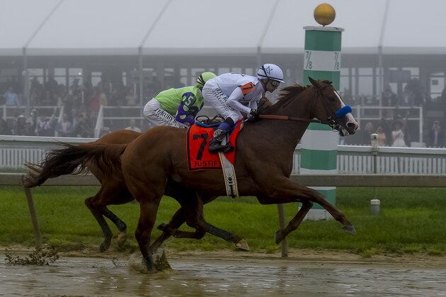 BALTIMORE, MD - MAY 19: Justify, #7, ridden by jockey Mike Smith, wins the 143rd running of the Preakness Stakes at Pimlico Race Course on May 19, 2018 in Baltimore, Maryland (Photo by Sydney Serio/Eclipse Sportswire/Getty Images)