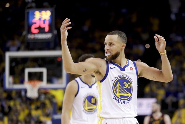 Golden State Warriors guard Stephen Curry (30) reacts during the second half of Game 1 of basketball's NBA Finals against the Cleveland Cavaliers in Oakland, Calif., Thursday, May 31, 2018. (AP Photo/Marcio Jose Sanchez)