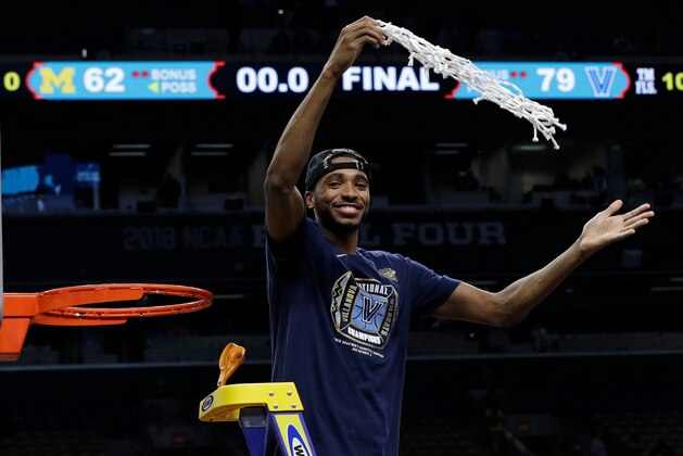 Villanova's Mikal Bridges cuts the net as he celebrates after the championship game of the Final Four NCAA college basketball tournament against Michigan, Monday, April 2, 2018, in San Antonio. Villanova won 79-62. (AP Photo/David J. Phillip) Villanova's Mikal Bridges cuts the net as he celebrates after the championship game of the Final Four NCAA college basketball tournament against Michigan, Monday, April 2, 2018, in San Antonio. Villanova won 79-62. (AP Photo/David J. Phillip)