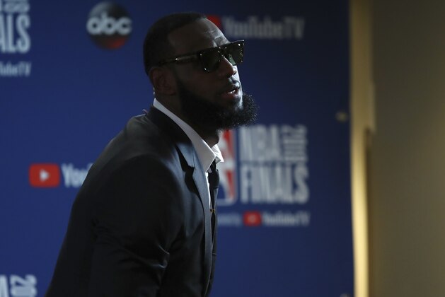 Cleveland Cavaliers forward LeBron James leaves a news conference after Game 1 of basketball's NBA Finals against the Golden State Warriors in Oakland, Calif., Thursday, May 31, 2018. The Warriors won 124-114 in overtime. (AP Photo/Ben Margot)