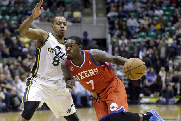 Philadelphia 76ers' Royal Ivey (7) drives against Utah Jazz's Randy Foye (8) in the first quarter during an NBA basketball game Monday, March 25, 2013, in Salt Lake City.  (AP Photo/Rick Bowmer)