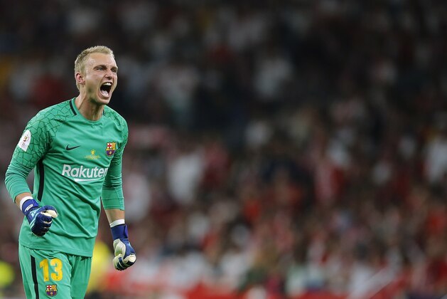 Barcelona goalkeeper Jasper Cillessen celebrates after Luis Suarez scoring his side's opening goal during the Copa del Rey final soccer match between Barcelona and Sevilla at the Wanda Metropolitano stadium in Madrid, Spain, Saturday, April 21, 2018. (AP Photo/Paul White)