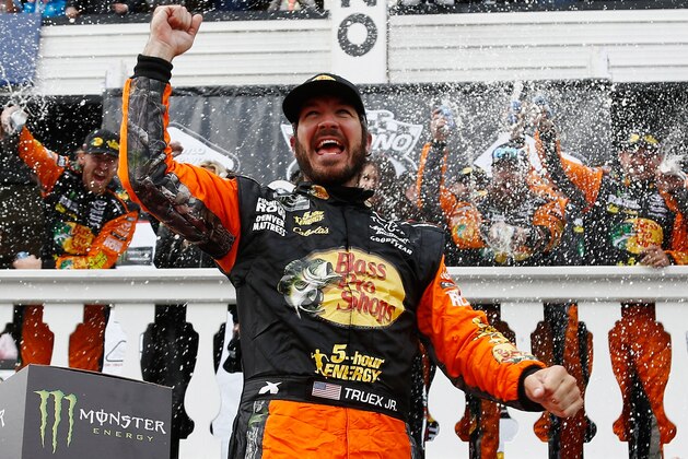 LONG POND, PA - JUNE 03:  Martin Truex Jr., driver of the #78 Bass Pro Shops/5-hour ENERGY Toyota, celebrates in Victory Lane after winning the Monster Energy NASCAR Cup Series Pocono 400 at Pocono Raceway on June 3, 2018 in Long Pond, Pennsylvania.  (Photo by Jeff Zelevansky/Getty Images)