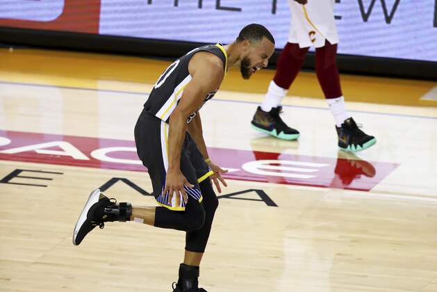 Golden State Warriors guard Stephen Curry celebrates after scoring against the Cleveland Cavaliers during the first half of Game 2 of basketball's NBA Finals in Oakland, Calif., Sunday, June 3, 2018. (AP Photo/Ben Margot)
