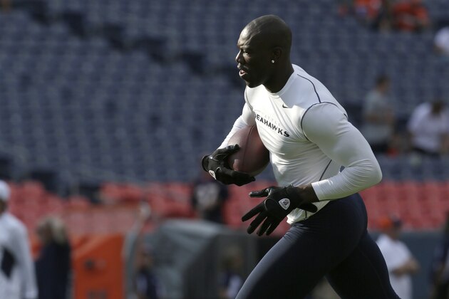 Seattle Seahawks'  Terrell Owens gestures during warm-ups before an NFL football preseason game against the Denver Broncos, Saturday, Aug. 18, 2012, in Denver. (AP Photo/Joe Mahoney)