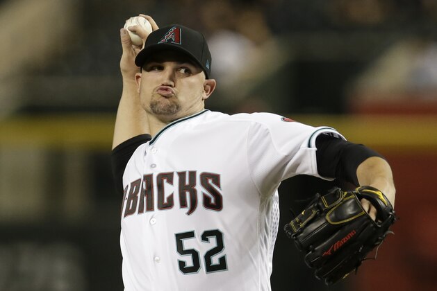 Arizona Diamondbacks pitcher Zack Godley throws during the first inning of the team's baseball game against the Cincinnati Reds, Tuesday, May 29, 2018, in Phoenix. (AP Photo/Rick Scuteri)