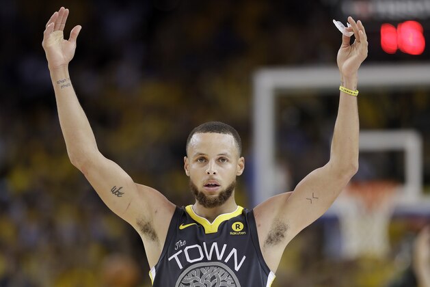Golden State Warriors guard Stephen Curry (30) celebrates during the second half of Game 2 of basketball's NBA Finals between the Warriors and the Cleveland Cavaliers in Oakland, Calif., Sunday, June 3, 2018. The Warriors won 122-103. (AP Photo/Marcio Jose Sanchez)