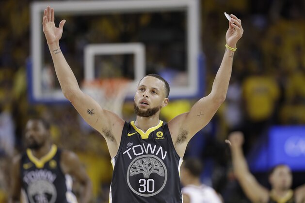 Golden State Warriors guard Stephen Curry (30) celebrates during the second half of Game 2 of basketball's NBA Finals between the Warriors and the Cleveland Cavaliers in Oakland, Calif., Sunday, June 3, 2018. The Warriors won 122-103. (AP Photo/Marcio Jose Sanchez)