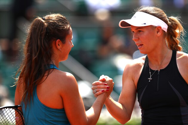 PARIS, FRANCE - JUNE 04:  Caroline Wozniacki of Denmark congratulates  Daria Kasatkina of Russia on victory following their ladies singles fourth round match during day nine of the 2018 French Open at Roland Garros on June 4, 2018 in Paris, France.  (Photo by Cameron Spencer/Getty Images)