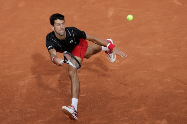 TOPSHOT - Serbia's Novak Djokovic plays a forehand return to Spain's Fernando Verdasco during their men's singles fourth round match on day eight of The Roland Garros 2018 French Open tennis tournament in Paris on June 3, 2018. (Photo by Thomas SAMSON / AFP)        (Photo credit should read THOMAS SAMSON/AFP/Getty Images)
