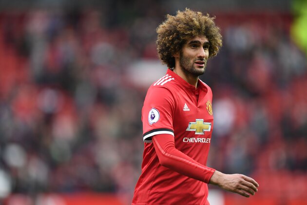Manchester United's Belgian midfielder Marouane Fellaini leaves the pitch after the English Premier League football match between Manchester United and Arsenal at Old Trafford in Manchester, north west England, on April 29, 2018. - Manchester United won the game 2-1. (Photo by Paul ELLIS / AFP) / RESTRICTED TO EDITORIAL USE. No use with unauthorized audio, video, data, fixture lists, club/league logos or 'live' services. Online in-match use limited to 75 images, no video emulation. No use in betting, games or single club/league/player publications. /         (Photo credit should read PAUL ELLIS/AFP/Getty Images)