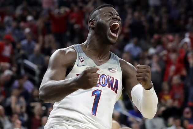 Arizona's Rawle Alkins celebrates after dunking against Southern California during the second half of an NCAA college basketball game for the Pac-12 men's tournament championship Saturday, March 10, 2018, in Las Vegas. Arizona won 75-61. (AP Photo/Isaac Brekken)