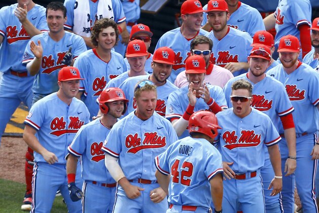 Mississippi players celebrate after Tim Rowe (42) hit a two run homer during the seventh inning of the Southeastern Conference tournament NCAA college baseball championship game against LSU, Sunday, May 27, 2018, in Hoover, Ala. (AP Photo/Butch Dill)