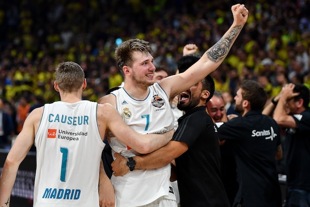 Real Madrid's Slovenian Luka Doncic (R) celebrates with team mate Real Madrid's French forward Fabien Causeur their team's 85-80 win in the Euroleague Final Four finals basketball match between Real Madrid and Fenerbahce Dogus Istanbul at The Stark Arena in Belgrade on May 20, 2018. (Photo by Andrej ISAKOVIC / AFP)        (Photo credit should read ANDREJ ISAKOVIC/AFP/Getty Images)