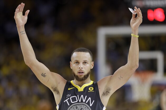 Golden State Warriors guard Stephen Curry (30) celebrates during the second half of Game 2 of basketball's NBA Finals between the Warriors and the Cleveland Cavaliers in Oakland, Calif., Sunday, June 3, 2018. The Warriors won 122-103. (AP Photo/Marcio Jose Sanchez)