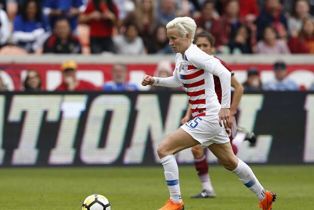 HOUSTON, TX - APRIL 08:  Megan Rapinoe #15 of United States dribbles the ball in the second half against the Mexico at BBVA Compass Stadium on April 8, 2018 in Houston, Texas.  (Photo by Tim Warner/Getty Images)