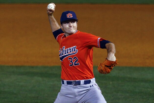 Auburn pitcher Casey Mize throws a pitch during the first inning of a Southeastern Conference tournament NCAA college baseball game against Texas A&M, Thursday, May 24, 2018, in Hoover, Ala. (AP Photo/Butch Dill)