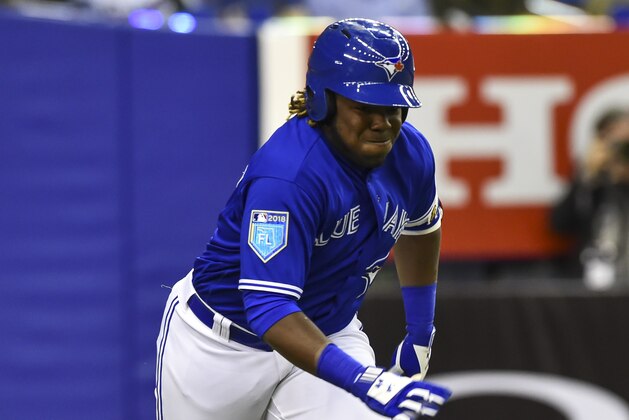 MONTREAL, QC - MARCH 27:  Vladimir Guerrero Jr. #27 of the Toronto Blue Jays runs towards first base against the St. Louis Cardinals during the MLB preseason game at Olympic Stadium on March 27, 2018 in Montreal, Quebec, Canada.  The Toronto Blue Jays defeated St. Louis Cardinals 1-0.  (Photo by Minas Panagiotakis/Getty Images)